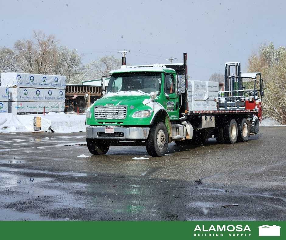Photo of Alamosa Building Supply delivery truck being loaded in the yard