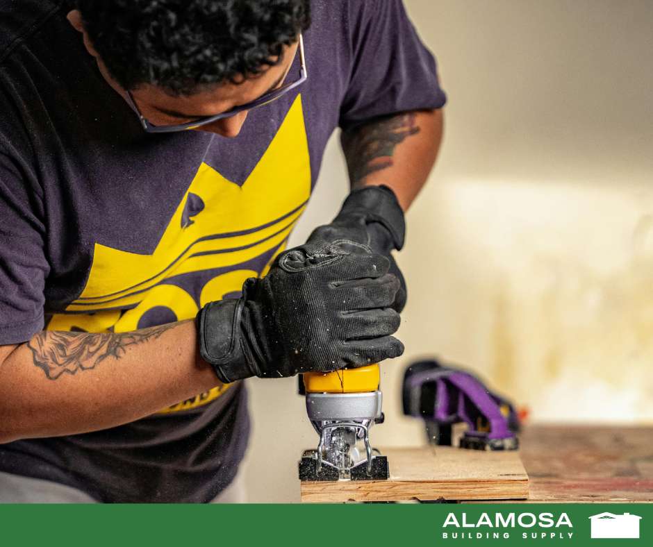 Man using a router to make decorative touches on wood project